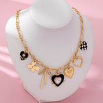 CHARM NECKLACE-BOW CHECKER HEART RHINESTONE | 80N92728
